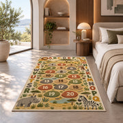 safari alphabet number trail rug displayed in a bedroom in sunlight
