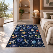 space alphabet adventure rug displayed in a bedroom in sunlight