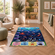 ocean creature search game rug displayed in a nursery beside an upholstered chair