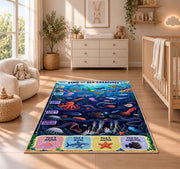 ocean creature search game rug displayed in a nursery beside a crib