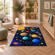 galaxy planet solar system learning rug displayed in a nursery beside an upholstered chair