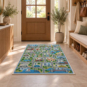 town map alphabet learning rug displayed in a entryway beside a wooden door