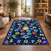 Space alphabet number trail rug displayed in a lounge with wooden shelves