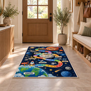 earth to mars rocket journey play map rug displayed in a entryway beside a wooden door