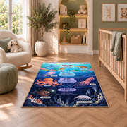 ocean depth creature chart rug displayed in a nursery beside an upholstered chair