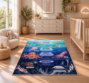 ocean depth creature chart rug displayed in a nursery beside a crib