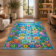 ocean alphabet number trail rug displayed in a lounge with wooden shelves