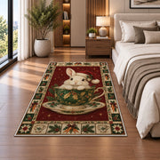 Bunny in Holly Teacup Christmas area rug in a bedroom beside the bed
