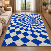 Blue Optical Checker Vortex area rug in a living room beside a sofa