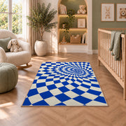 Blue Optical Checker Vortex area rug in a nursery with a crib and armchair