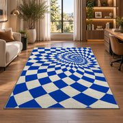 Blue Optical Checker Vortex area rug in a home office beside a desk