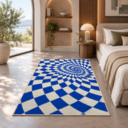 Blue Optical Checker Vortex area rug in a bedroom with an arched window