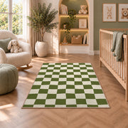 Sage Green Checkerboard area rug in a nursery with a crib and armchair