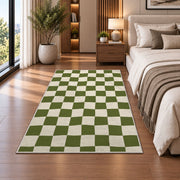 Sage Green Checkerboard area rug in a bedroom beside the bed