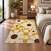 Retro Daisy Checker area rug in a bedroom beside the bed