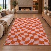 Wavy Orange and Pink Checkerboard area rug in a living room with a fireplace