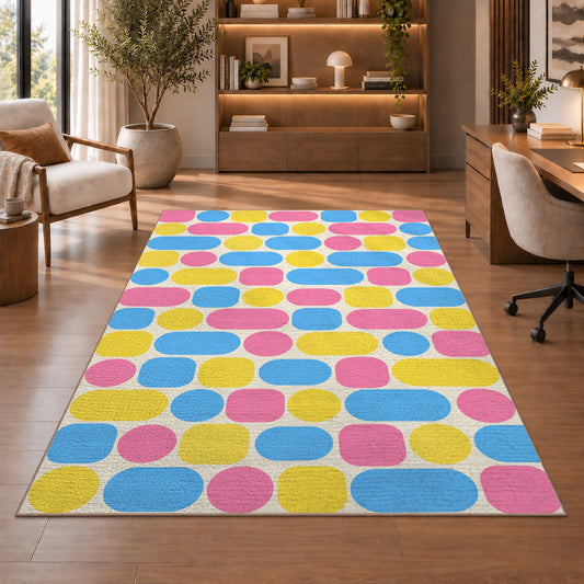 Pastel Pill Pattern area rug in a study with an armchair and bookshelves