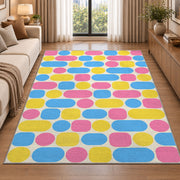 Pastel Pill Pattern area rug in a living room beside a sofa