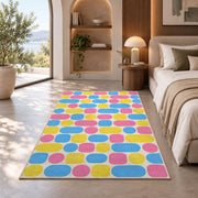 Pastel Pill Pattern area rug in a bedroom with an arched window