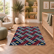 Fire Ladder Pattern firefighter rug in a nursery with a crib and armchair