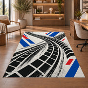 Tire Track Pattern police rug in a study with an armchair and bookshelves