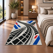 Tire Track Pattern police rug in a bedroom beside the bed