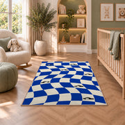 Wavy Checker with Patrol Cars police rug in a nursery with a crib and armchair