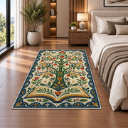 Tree of Books Folk Art area rug in a bedroom beside the bed