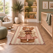 Teddy Bear Reading Book area rug in a nursery with a crib and armchair