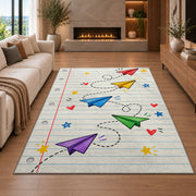 Paper Planes on Notebook Paper area rug in a living room with a fireplace
