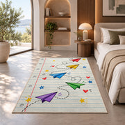 Paper Planes on Notebook Paper area rug in a bedroom with an arched window