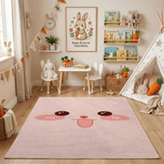 Pink Cute Face Area Rug — angled floor view