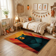Colorful geometric black bear rug centered in a cozy playroom