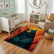 Colorful geometric black bear rug styled with soft nursery decor