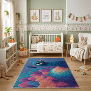 Colorful geometric owl rug shown beside a child’s bed