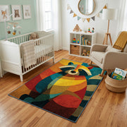 Colorful geometric owl rug styled with soft nursery decor