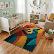 Colorful geometric bear rug styled with soft nursery decor