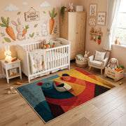 Colorful geometric toucan rug styled in a bright nursery