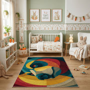 Colorful geometric chameleon rug shown beside a child's bed