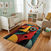 Colorful geometric owl rug styled with soft nursery decor