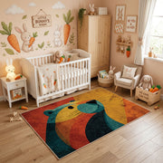 Colorful geometric whale rug styled in a bright nursery