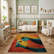 Colorful geometric whale rug shown beside a child's bed