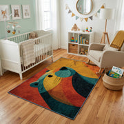 Colorful geometric whale rug styled with soft nursery decor