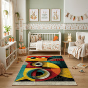 Colorful geometric owl rug shown beside a child's bed