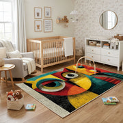 Colorful geometric owl rug shown near a reading corner