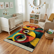 Colorful geometric owl rug styled with soft nursery decor