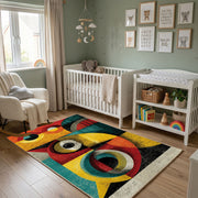 Colorful geometric owl rug wide room view in a modern nursery