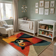 Colorful geometric woodland animal rug wide room view in a modern nursery