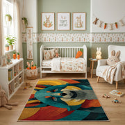 Colorful geometric raccoon rug shown beside a child's bed