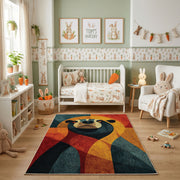 Colorful geometric panda rug shown beside a child's bed